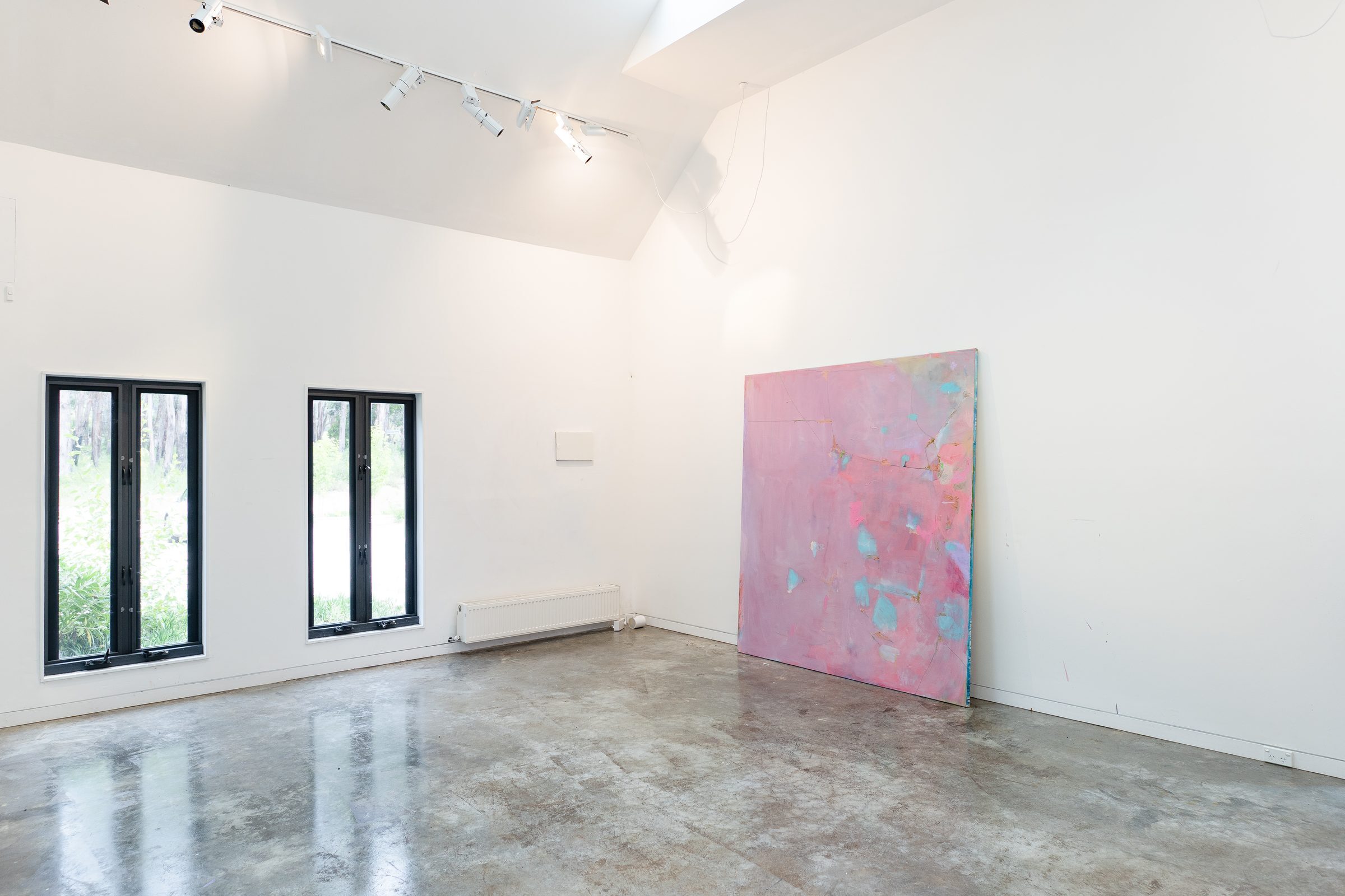 Gallery room with large pink abstract painting