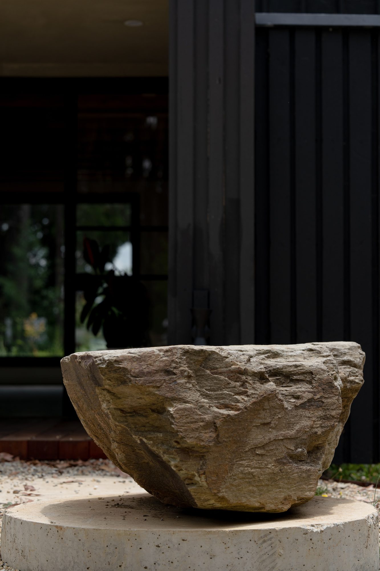 Stone basin sculpture at the Zen Lounge entrance
